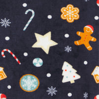 detail shot of gingerbread man, star, tree and candy cane pattern on navy blue oversized hoodie
