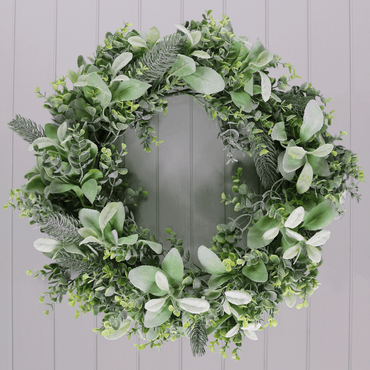 mr crimbo artiticial mixed green foliage eucalyptus christmas wreath hanging on grey interior door