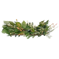 side view of christmas wreath highlighting depth of wreath, which features pink flower sprays, realistic foliage