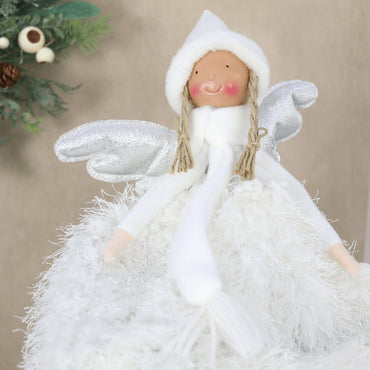angel tree topper with silver wings on neutral background with wreath in the background
