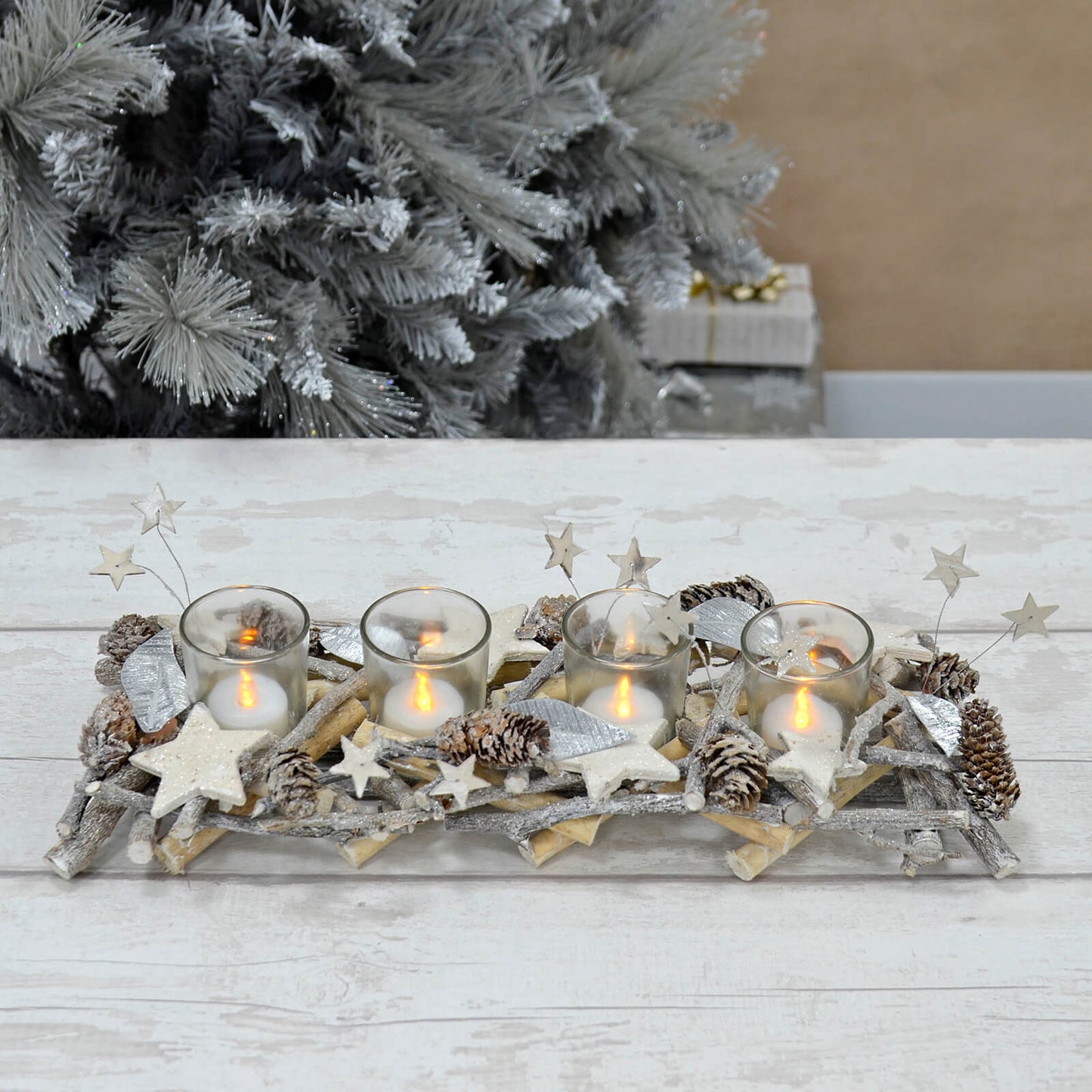 Mr Crimbo Christmas candle holder with twig base, 4 tea lights in glass jars, silver leaves, stars and pine cones