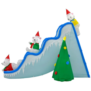Side view of Christmas inflatable decoration shaped like an ice slide with 3 polar bears and a Christmas tree