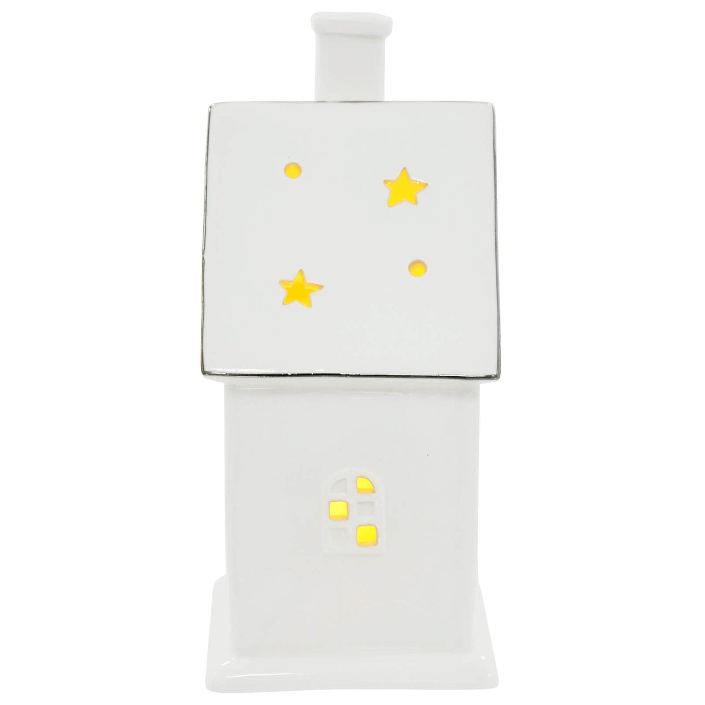 Side view of white ceramic house Christmas ornament with warm white LED light shining through a window and cut away stars