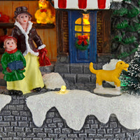 Close up detail of Christmas toy shop showing woman, child and dog with glittering snow and LED lights