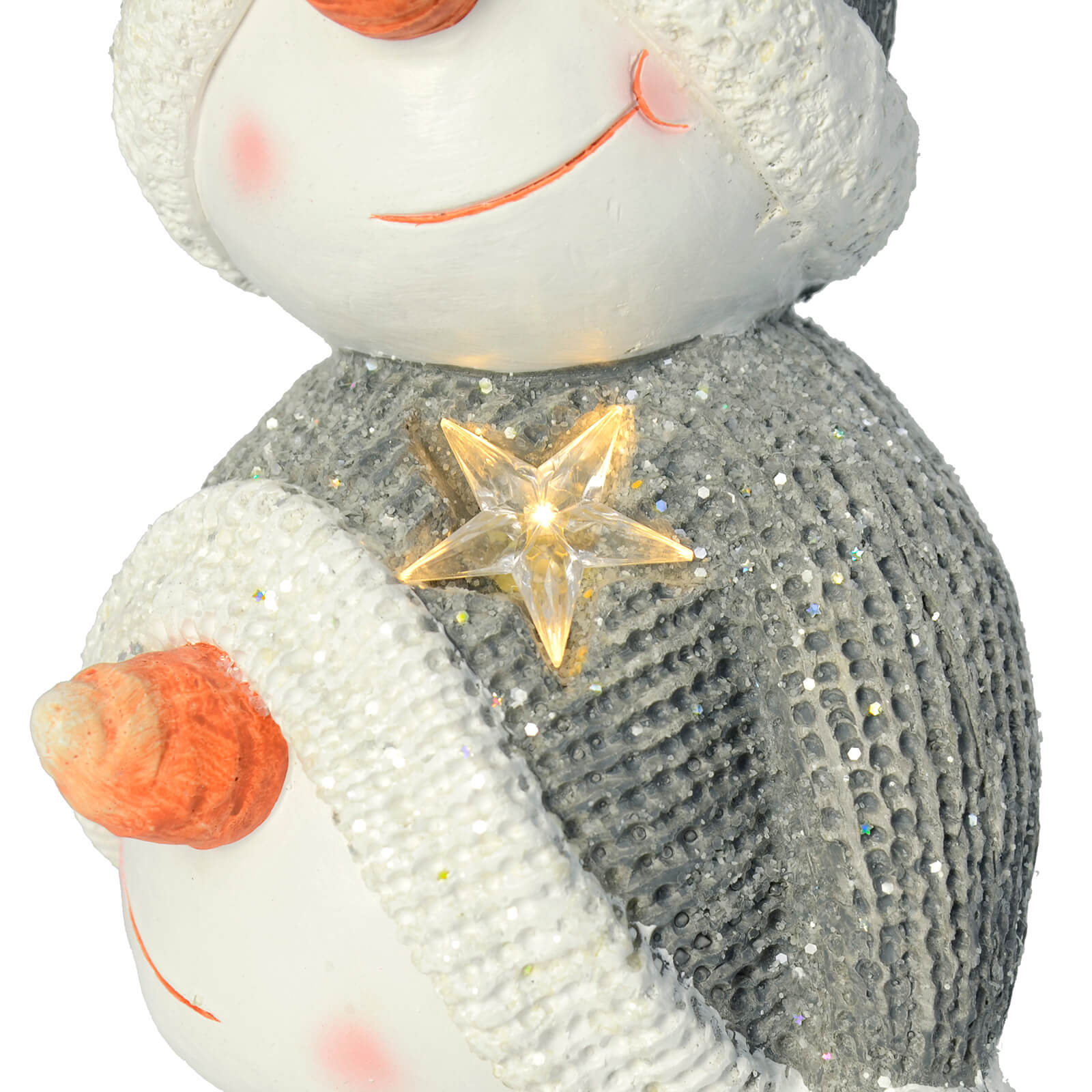 Close up of snowmen stack showing a warm white LED star on a grey and white bobble hat of a snowmen stack ceramic Christmas decoration