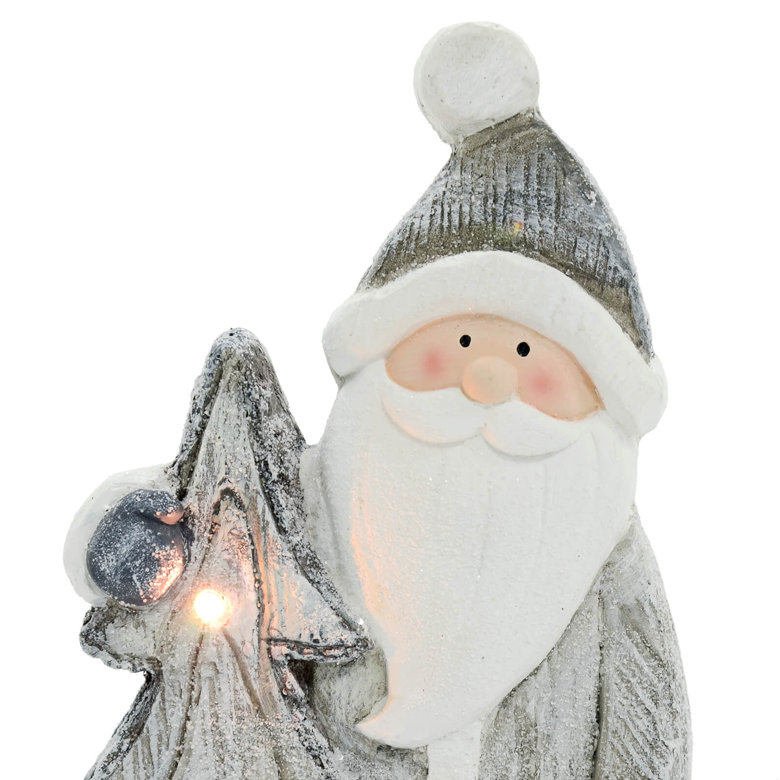 Close up detail of Santa and Christmas tree ceramic ornament in grey and white with warm white LED lights