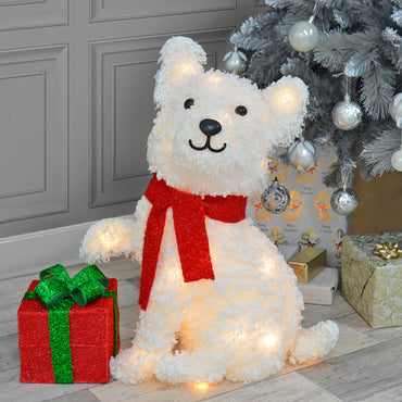 White puppy Christmas snow dog figure light up decoration with glittering present and red scarf, silver Christmas tree and presents