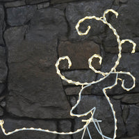 Close up of Christmas reindeer silhouette outdoor decoration showing warm white LED lights on a white wire frame